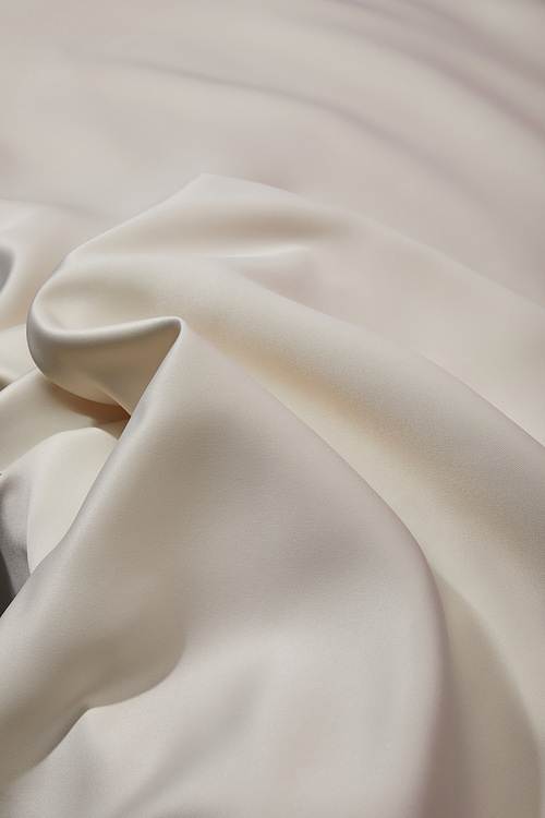 close up view of white soft and crumpled silk cloth