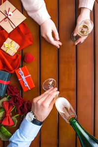 cropped image of man pouring champagne in glass