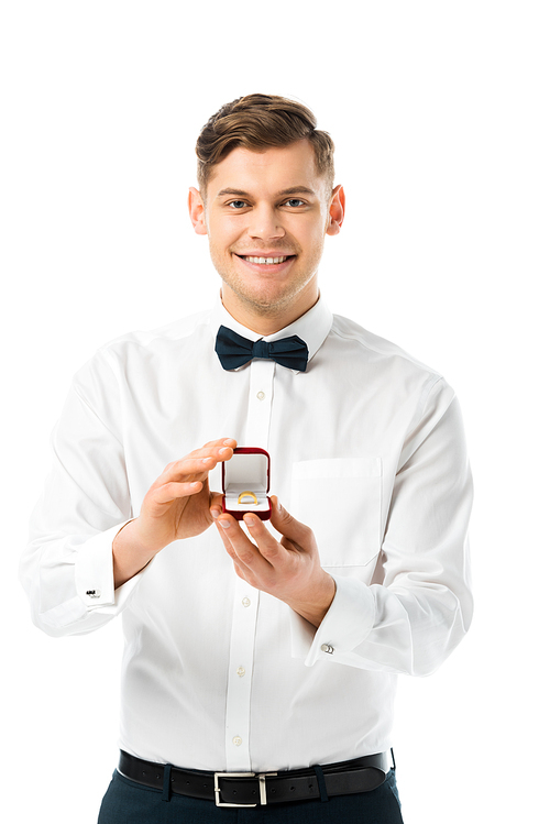 happy groom demonstrating gift box with wedding ring and  isolated on white