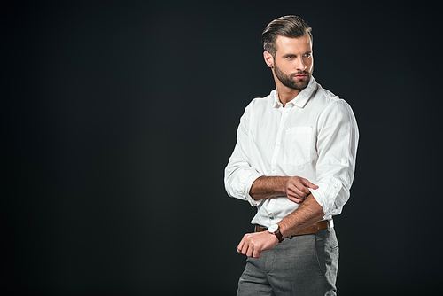 handsome businessman in white shirt, isolated on black