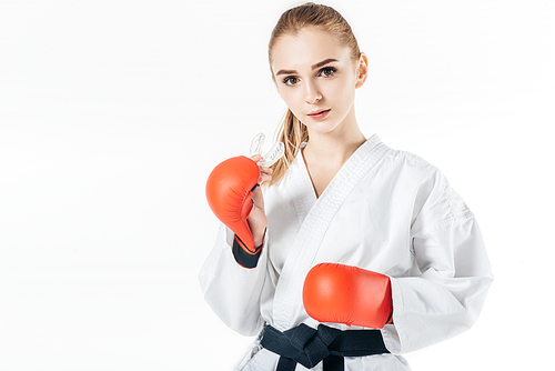 female karate fighter  with mouthguard and gloves isolated on white