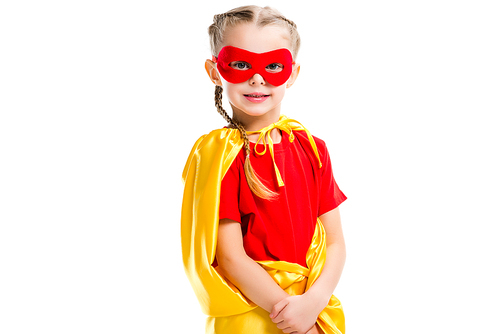 Portrait of little supergirl wearing yellow cape and red mask for eyes isolated on white