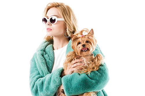 Young girl in fur coat with fluffy dog isolated on white
