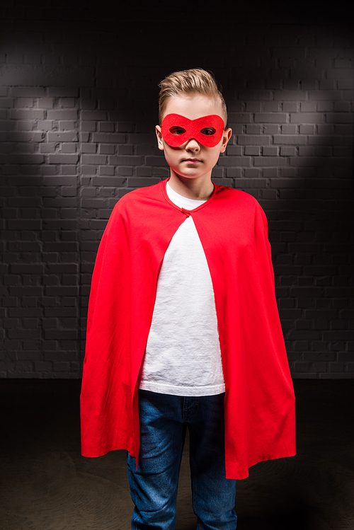 boy in superhero costume and red mask