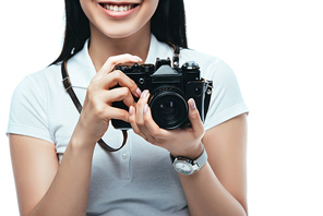 cropped view of smiling brunette asian woman taking picture on digital camera isolated on white