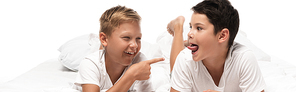 panoramic shot of cheerful boy pointing with finger at brother sticking out tongue isolated on white