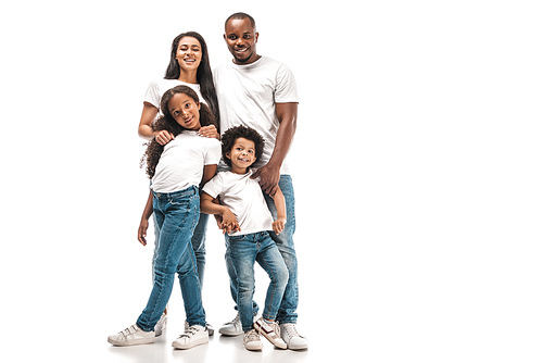 happy african american parents with daughter and son smiling at camera while standing on white background