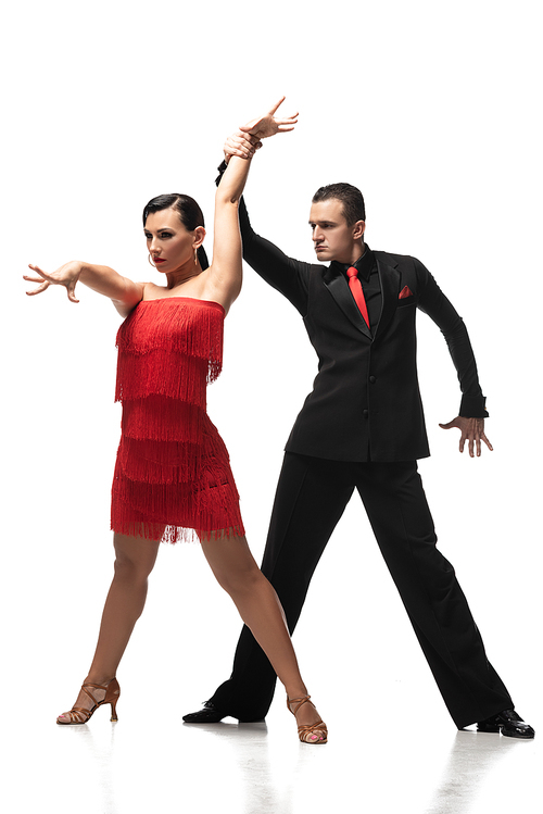 passionate, stylish dancers performing tango on white background