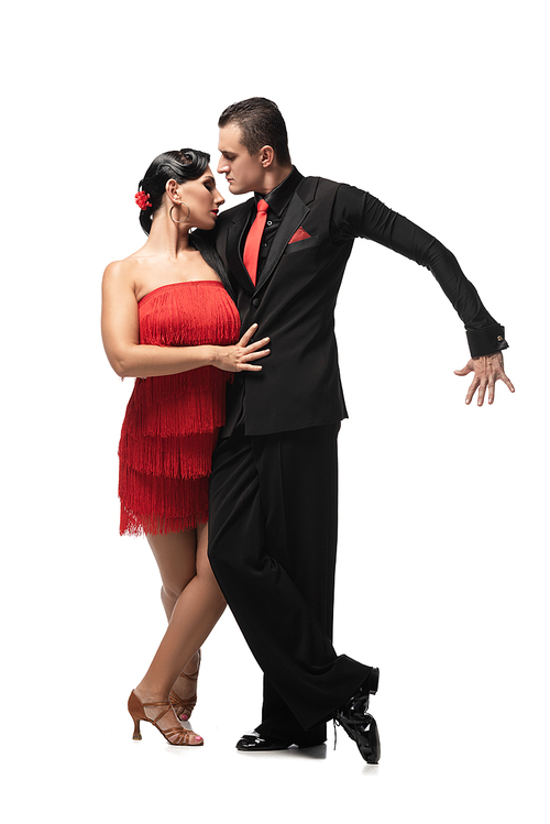 passionate, stylish dancers performing tango on white background