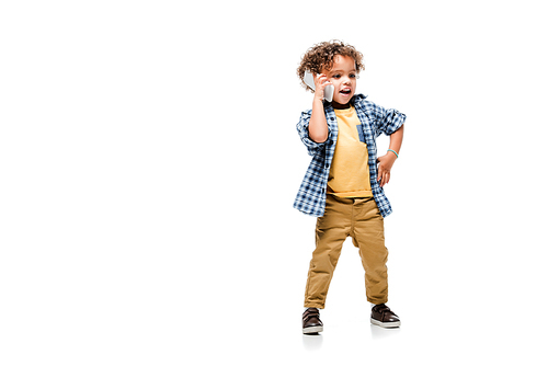 positive african american boy talking on smartphone, isolated on white