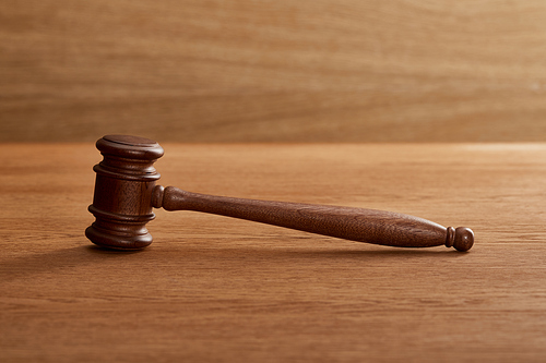 wooden gavel on brown wooden table with copy space