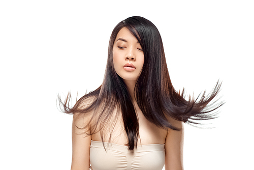 portrait of young asian woman with beautiful and healthy hair looking away isolated on white