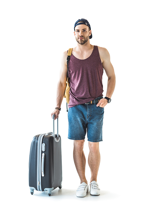 male traveler with suitcase ready for trip, isolated on white