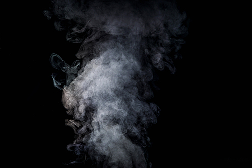 abstract background with grey smoke on black