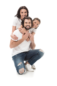 happy family in white shirts and jeans  isolated on white