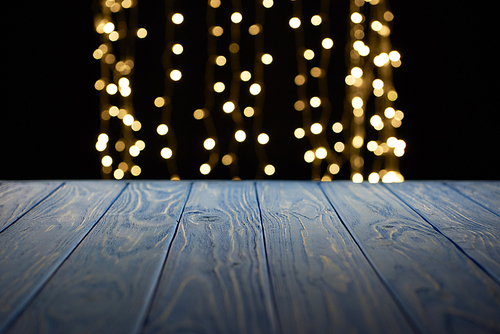 empty wooden surface and beautiful golden lights bokeh background