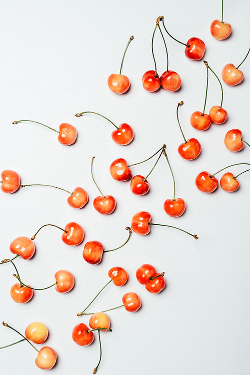 top view of fresh ripe sweet cherries on white background