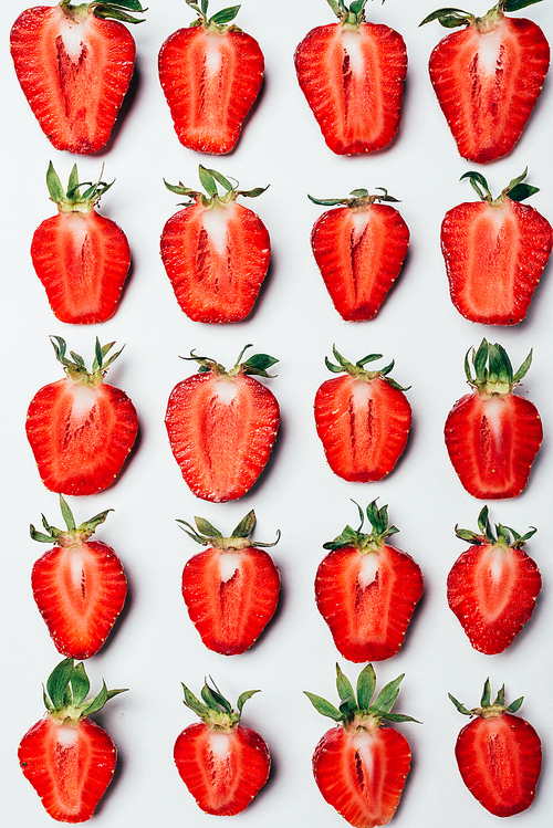 seamless pattern made of ripe fresh sliced strawberries on white