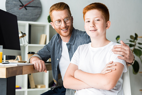 happy father hugging son at home