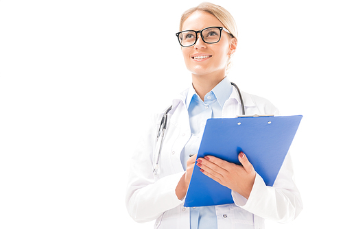 bottom view of confident young female doctor with clipboard looking away isolated on white