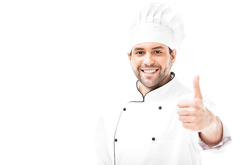 happy young chef showing thumb up at camera isolated on white