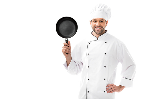 handsome young chef holding frying pan and  isolated on white