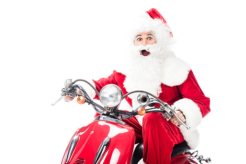 surprised santa claus in costume riding on scooter isolated on white