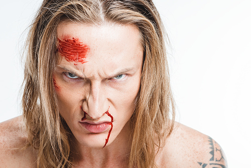 close up of angry man with bloody wounds on face isolated on white