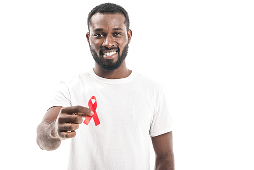 smiling african american man in blank white t-shirt holding aids awareness red ribbon and  isolated on white