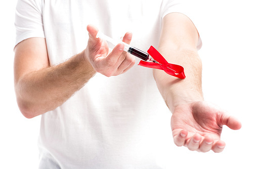 cropped image man making hiv test with syringe isolated on white, world aids day concept