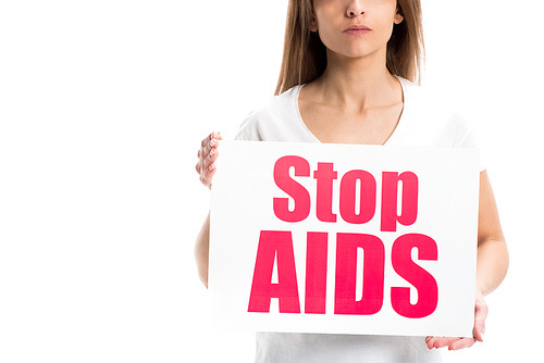 cropped image of woman holding card with stop aids text isolated on white, world aids day concept