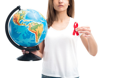cropped image of woman holding globe and red ribbon isolated on white, world aids day concept