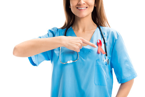 cropped image of smiling doctor pointing on red ribbon isolated on white, world aids day concept