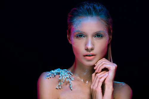 Sensual girl with decorative snowflake and frosty make up  isolated on black