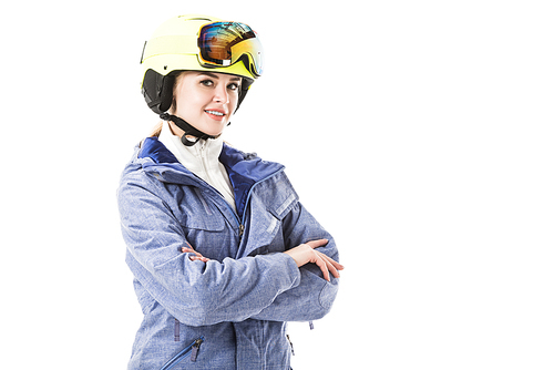 Pretty woman in blue ski jacket, goggles and helmet smiling and  isolated on white