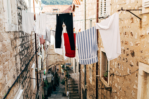 urban scene with laundry and empty narrow city street in Dubrovnik, Croatia