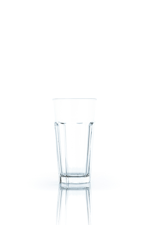 one clear empty glass on white with reflection