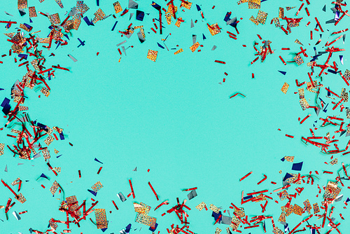 top view of frame of messy confetti isolated on green