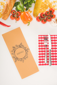 top view of decorative menu, cutlery and ingredients on white