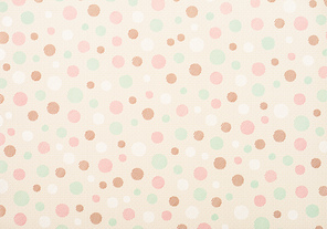 set of different sized colored circles on beige