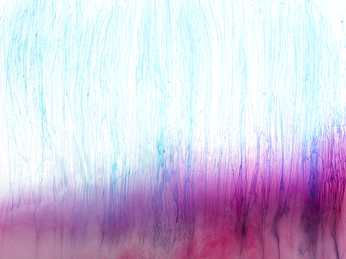 close up view of pink and blue paint splashes