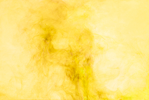 close up view of yellow paint splashes