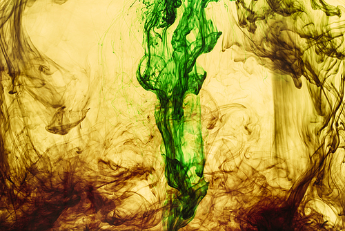 full frame of yellow and green paint splashes and swirls