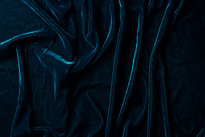 top view of dark green velvet textile as background