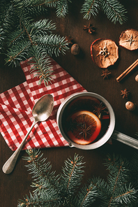 top view of homemade traditional mulled wine with spices on wooden background