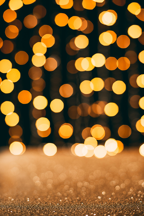 golden sparkling sequins with bokeh on background, christmas concept