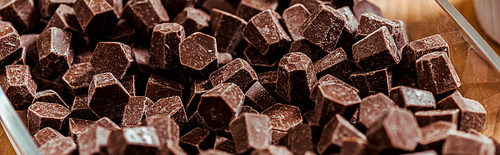 panoramic shot of dark and sweet chocolate cubes