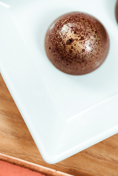 top view of sweet chocolate ball with golden powder