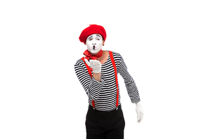 grimacing mime sending air kiss isolated on white