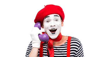 happy mime talking by ultra violet retro stationary telephone isolated on white